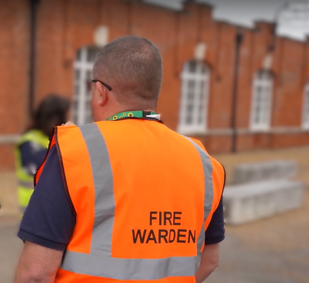 A man in an orange life saving jacket