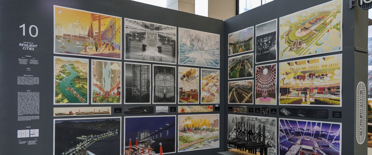 End of Year Exhibition showing a student’s model. The image displays an exhibition showcasing architectural renderings and plans related to 