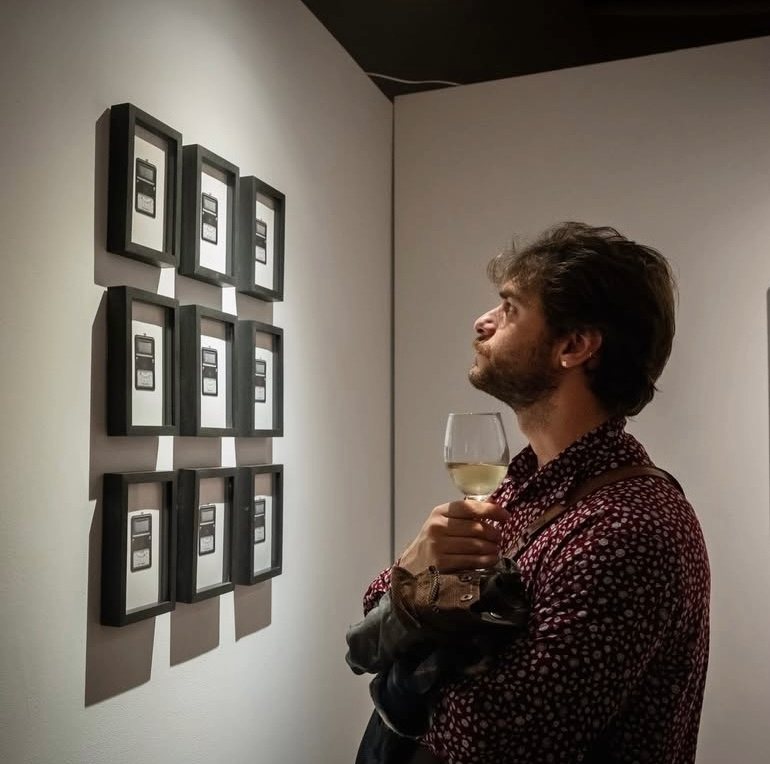 Image of person admiring work as part of the exhibition mentioned