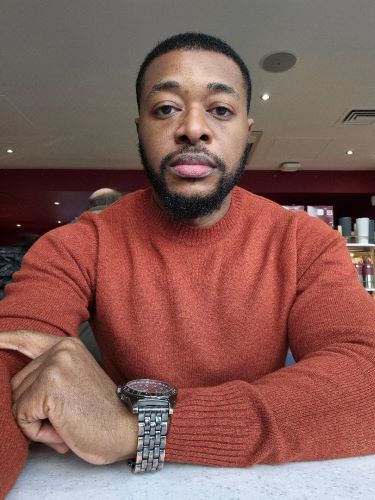 Emmanual looking straight to the camera