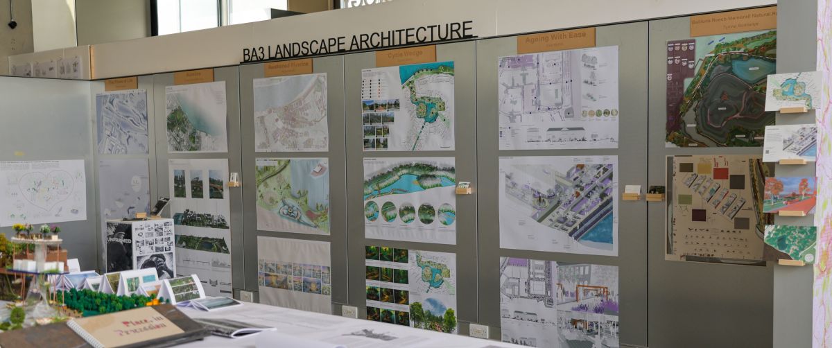 Photograph of end of year exhibition, showing drawings and models from the undergraduate Landscape Architecture Design Studio modules.