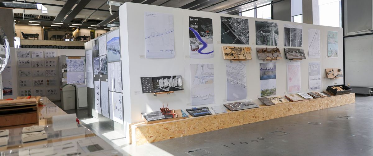Photograph of end of year exhibition, showing drawings and models from the postgraduate Landscape Architecture Design Studio modules.