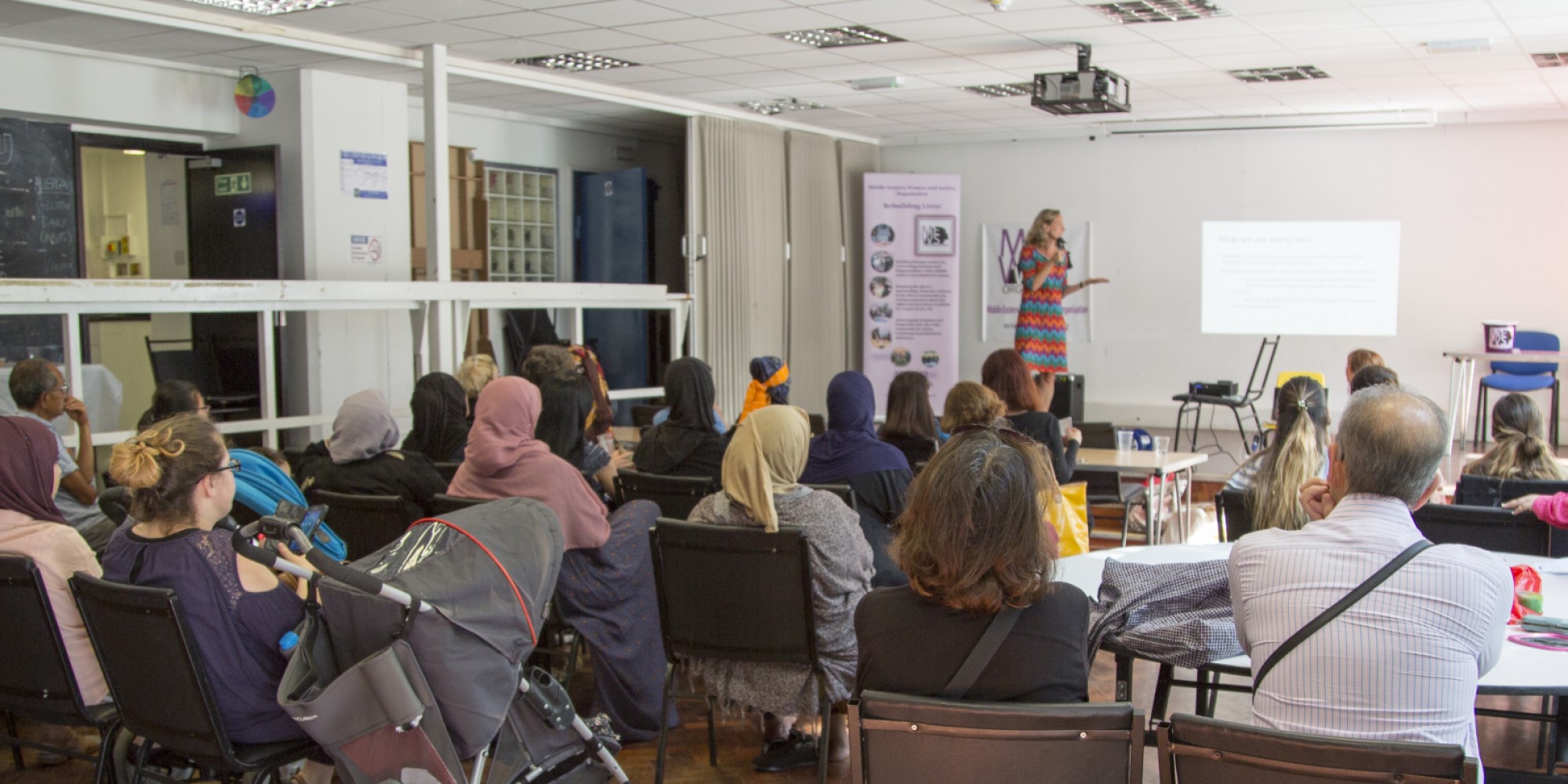 Audience and speaker at an Applied Sociology community event