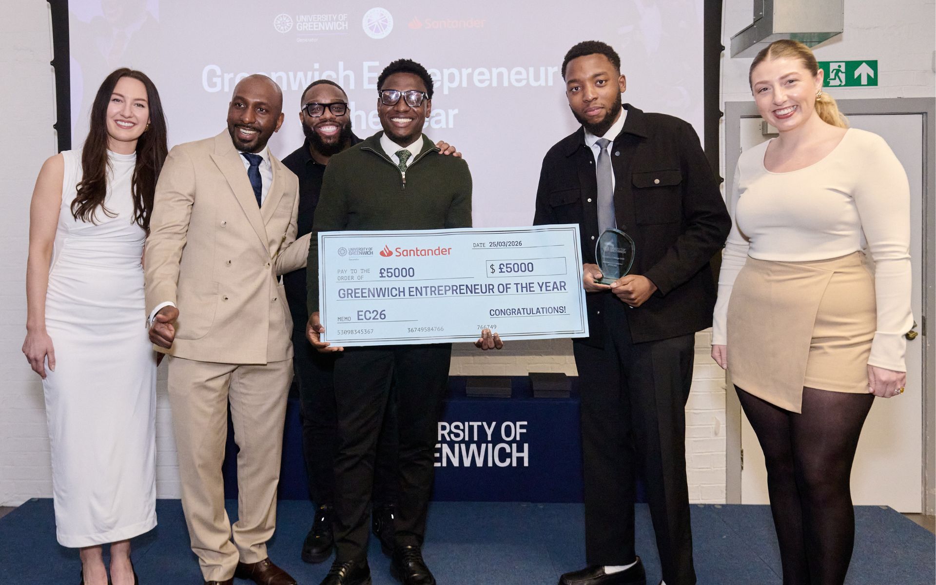 students on stage collecting award
