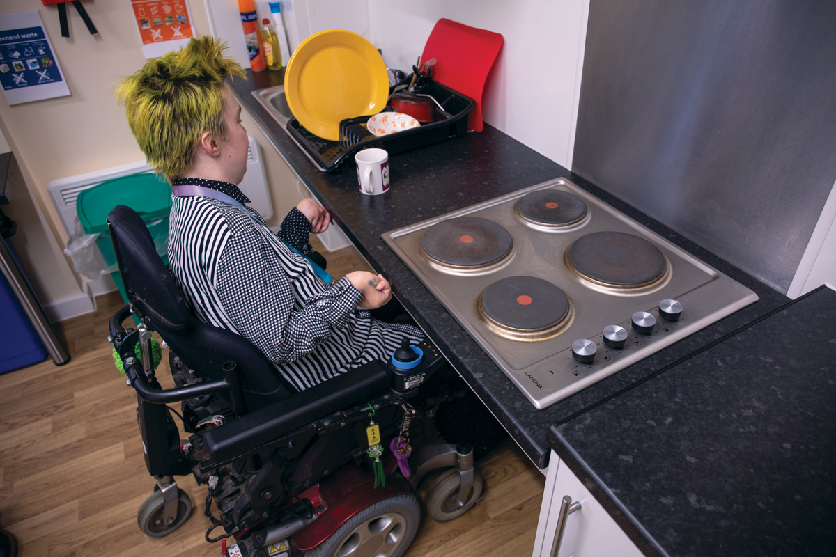 Student using an accessible kitchen at Devonport House