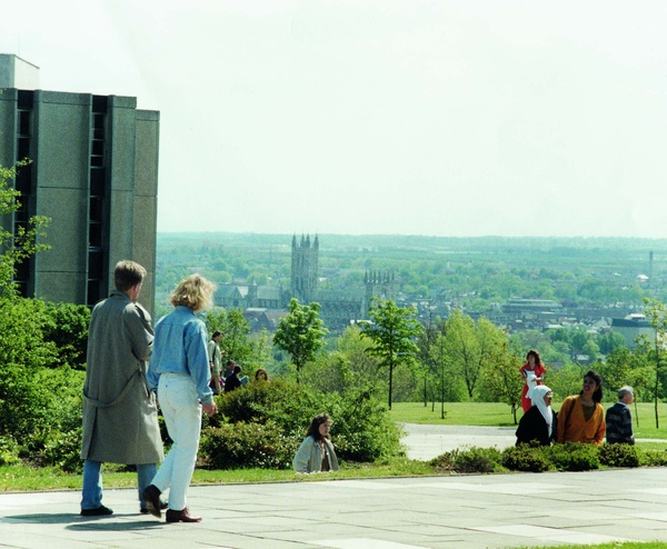 View from Rutherford College People walking on campus grounds with a city skyline visible in the distance from Rutherford College.