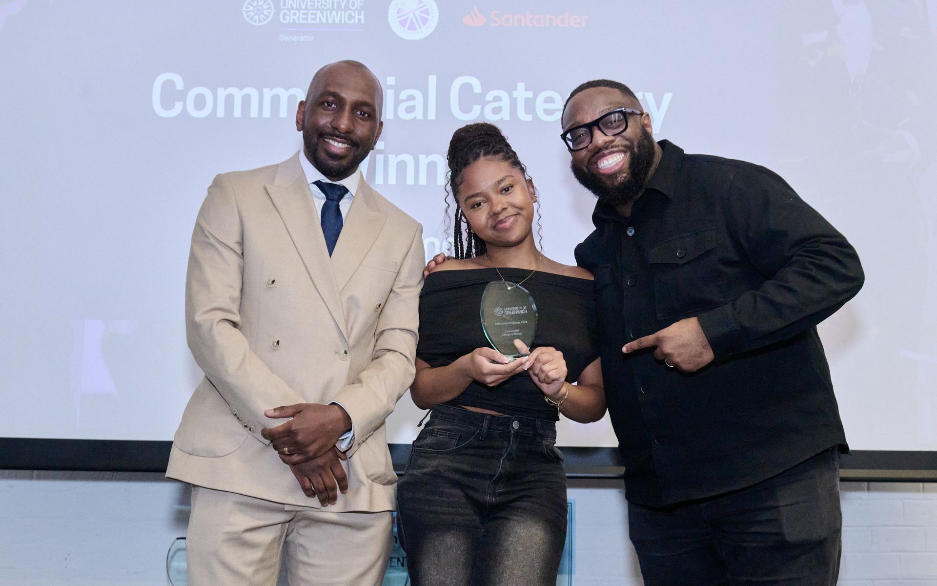 student on stage collecting an award