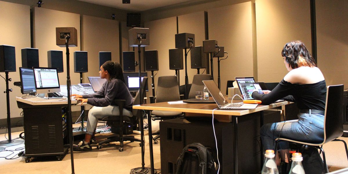 Students at separate desks in the studio.