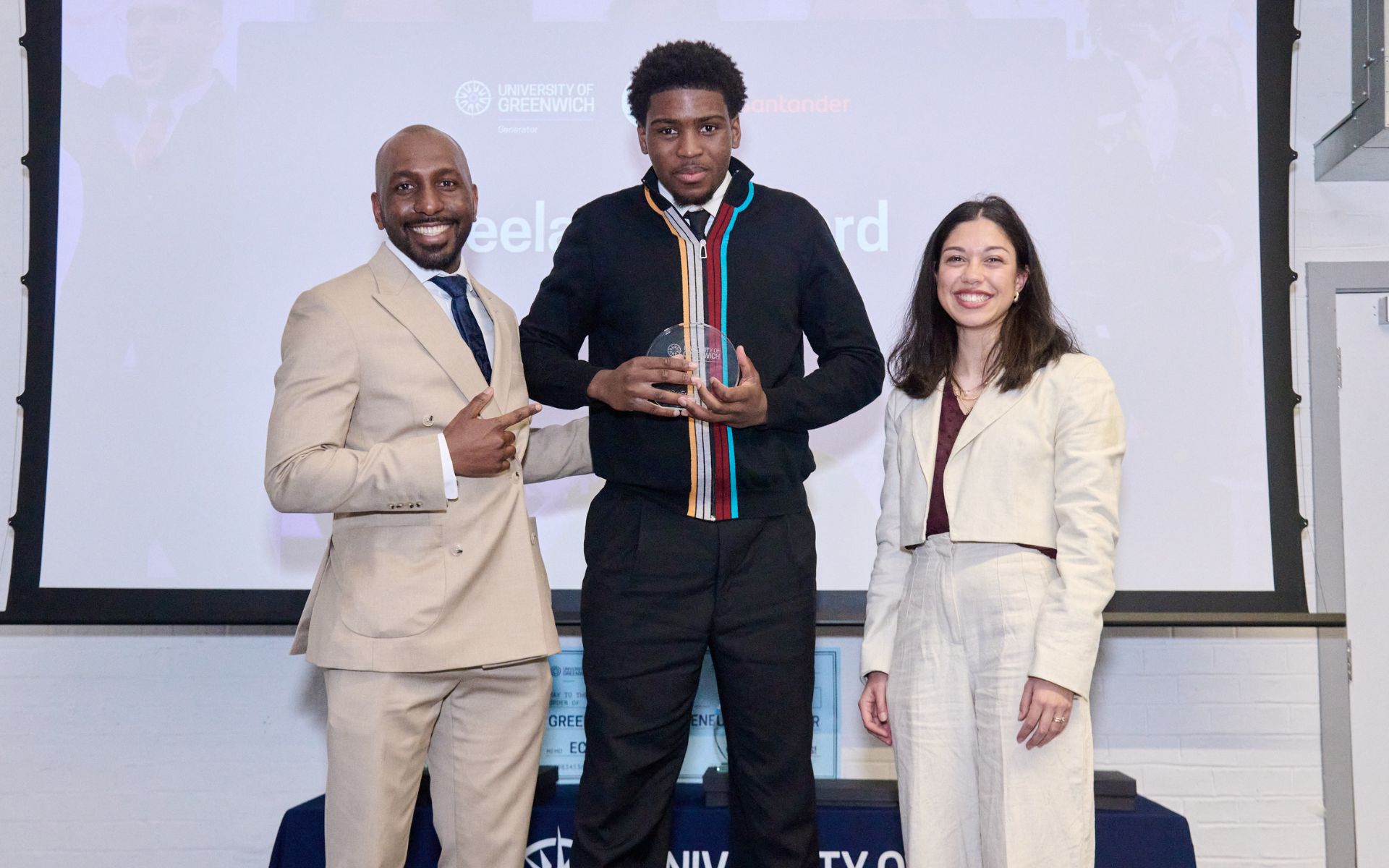 student on stage collecting an award
