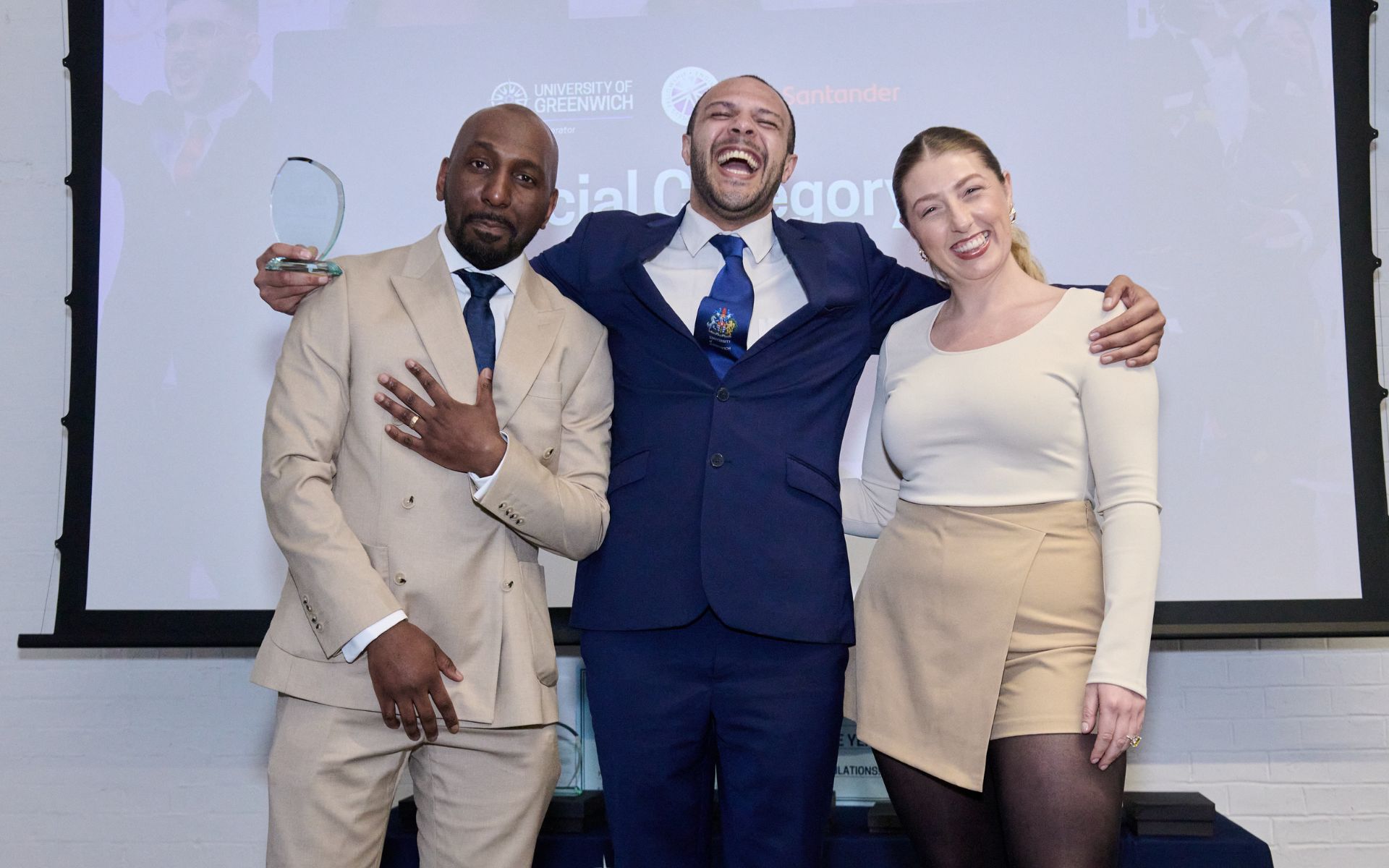 student on stage collecting an award