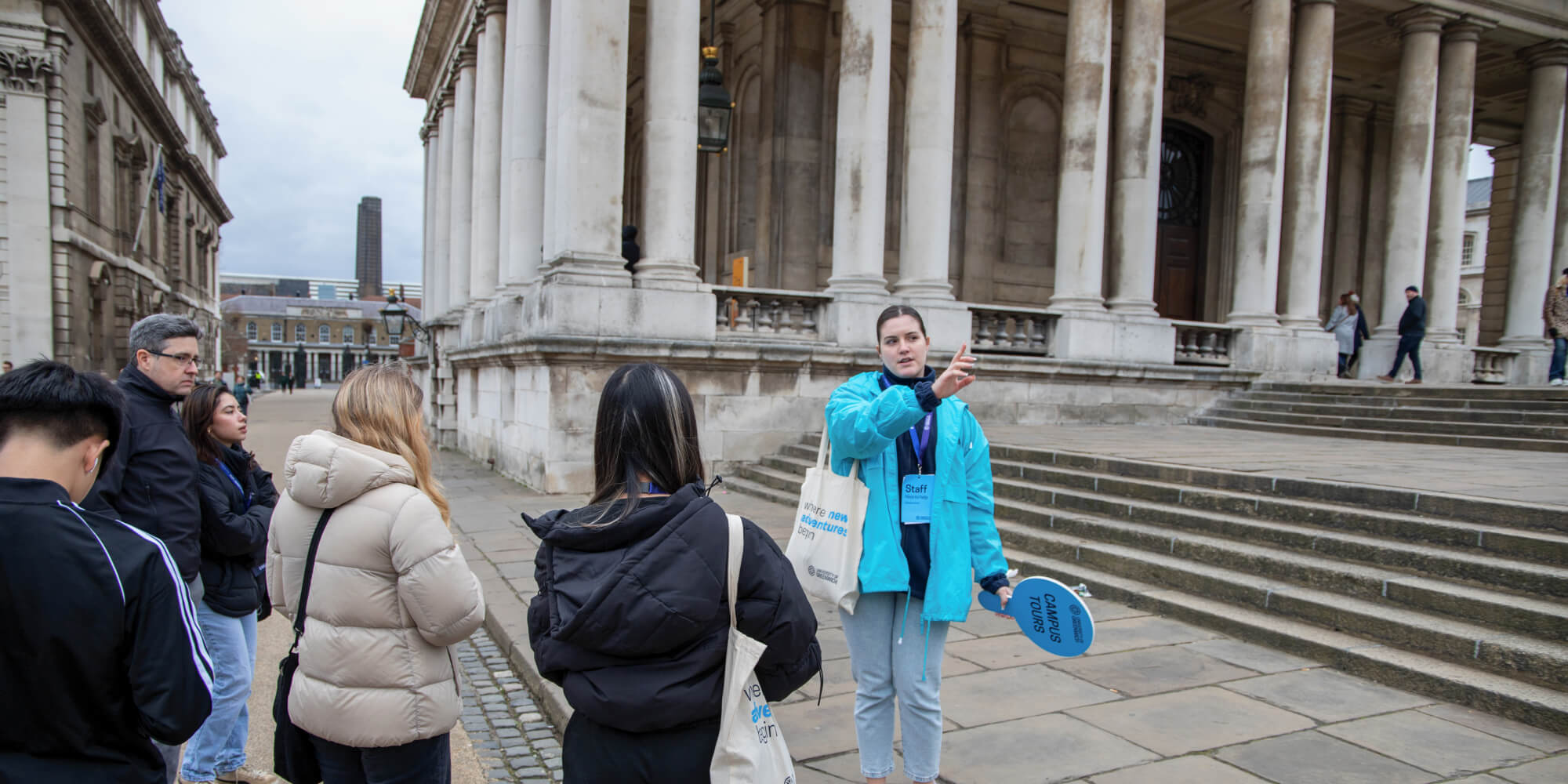 Image of a student ambassador giving a campus tour of the Greenwich Campus on an Open Day. 