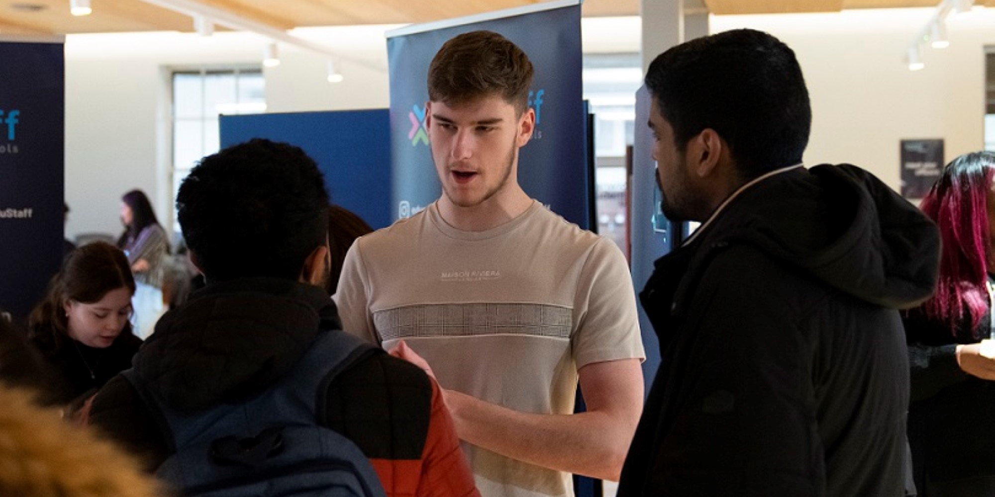An image of a student networking at a Careers Fair.