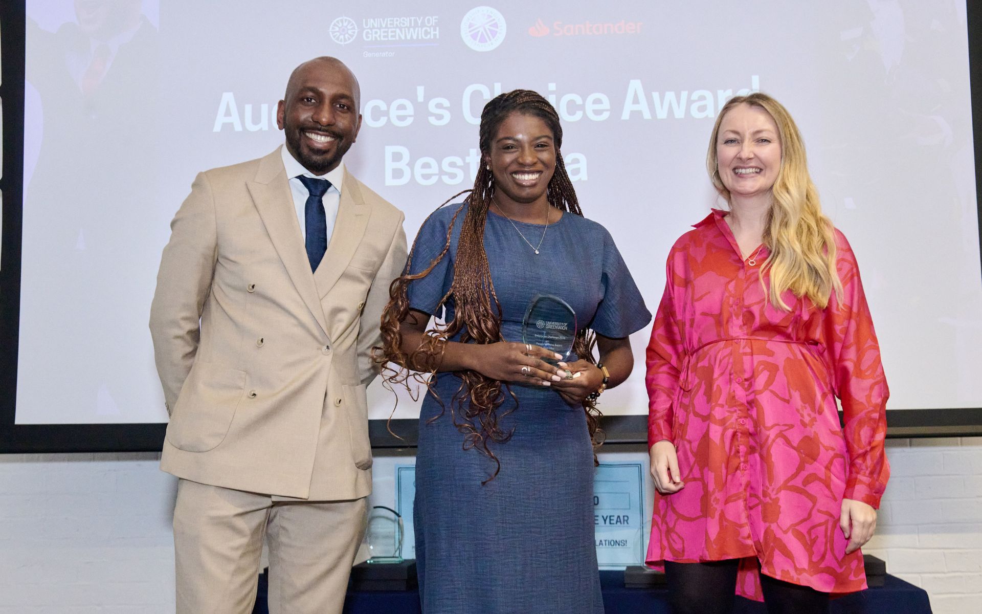 student on stage collecting an award