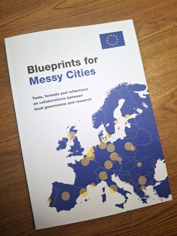 The report cover features a white background with a blue map of Europe dotted with yellow markers