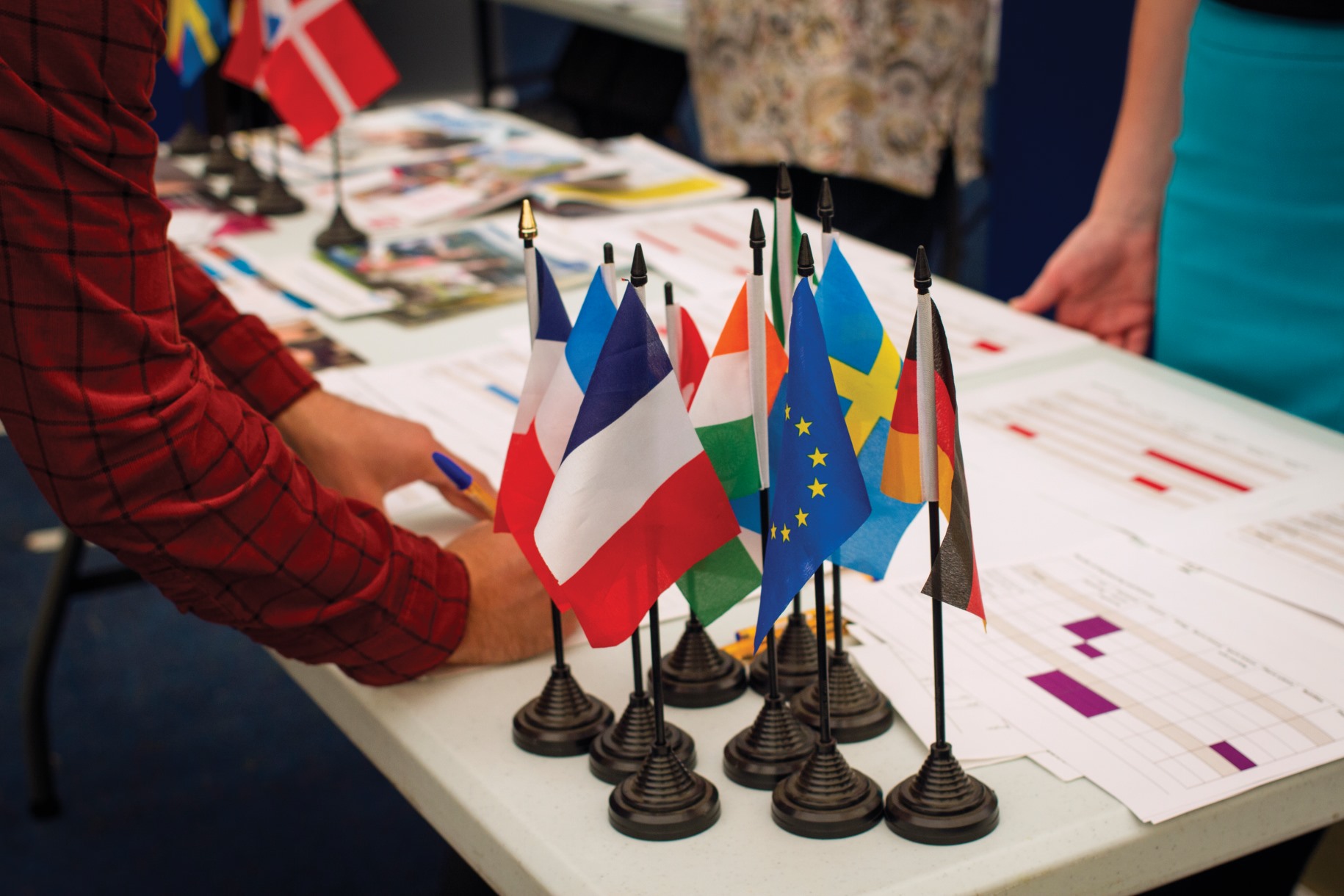 Table covered in the flags of various nations