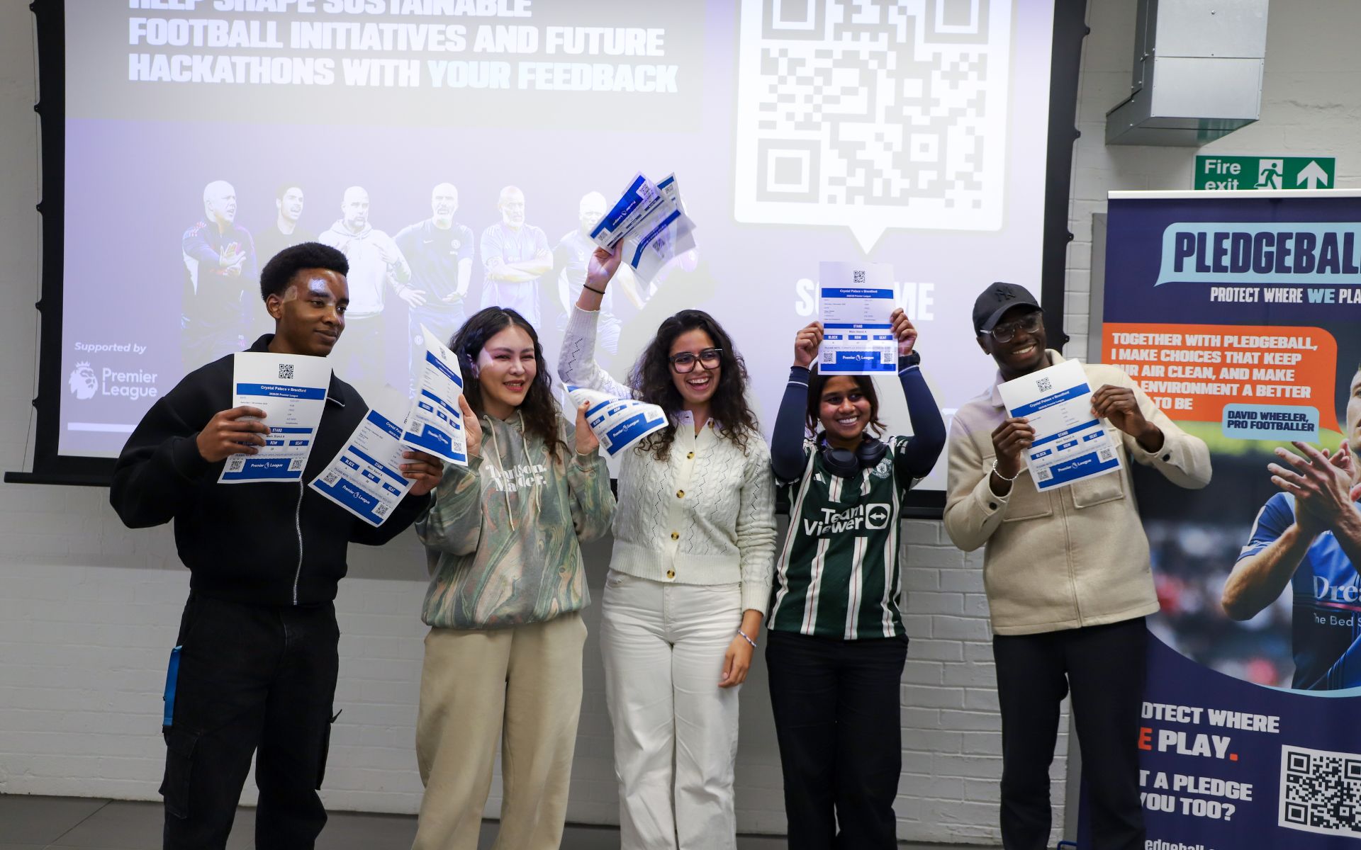 students holding awards at event