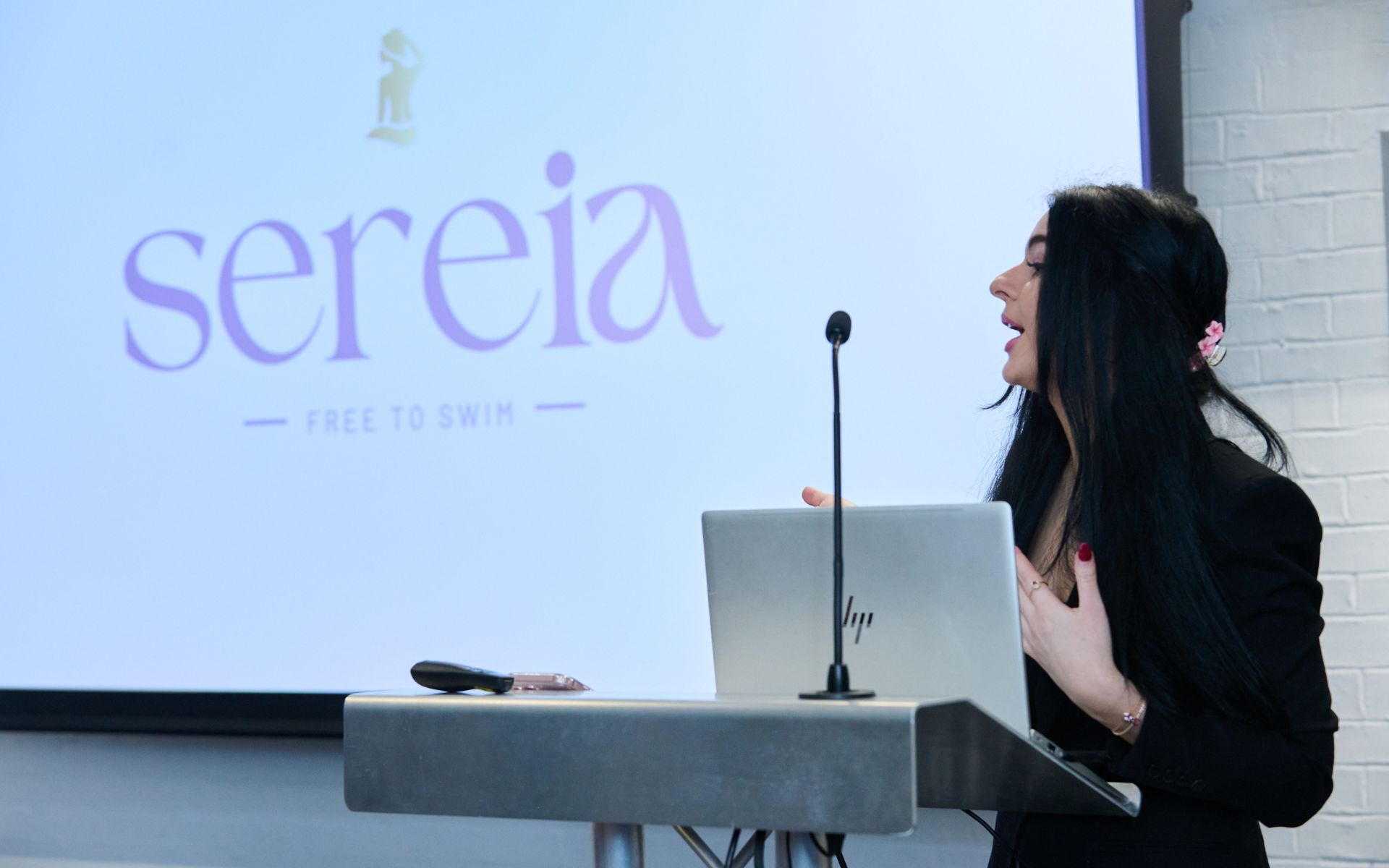 student presenting at lecturn